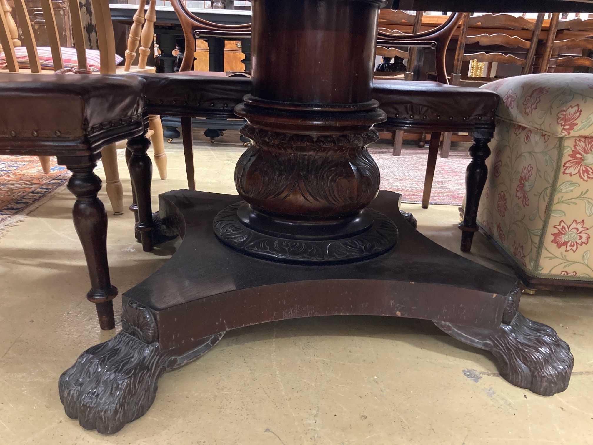 A large reproduction mahogany extending dining table, 174cm extended, width 138cm, height 77cm